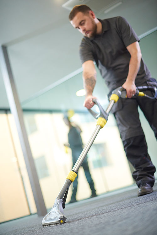 NWS Janitorial employee cleaning